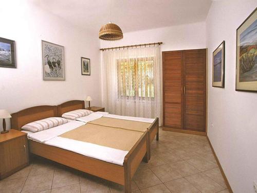 Postel nebo postele na pokoji v ubytování Apartment in Njivice - Insel Krk 38752