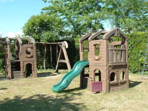 two playground equipment with a slide and a swing at Mobilehomes in Cavallino-Treporti 33773 in Cavallino-Treporti