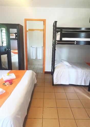 Ένα ή περισσότερα κρεβάτια σε δωμάτιο στο Hotel Oasis de Kiamu