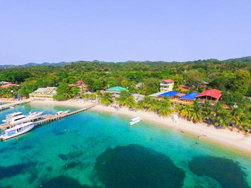 an aerial view of a beach with a boat in the water at Bella Luna Beach Condo #227487 in West End