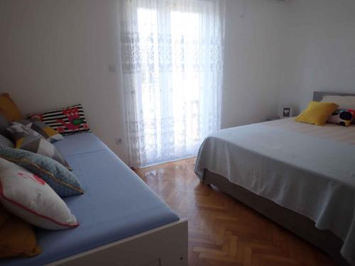 Posteľ alebo postele v izbe v ubytovaní Apartments in Starigrad-Paklenica 35542