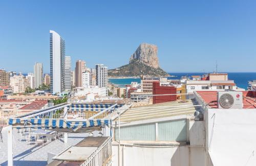 a view of a city with a mountain in the background at Pondarosa Penthouse 55 - Costa CarpeDiem in Calpe