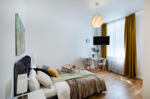 En eller flere senger på et rom på Residential Barona Apartments in Riga Centre