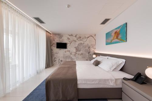 TV a/nebo společenská místnost v ubytování Aparthotel Joel