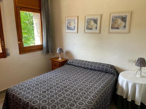 Un pat sau paturi într-o cameră la Cal Matia
