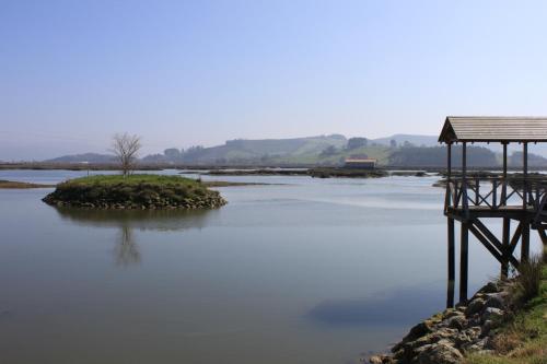a small island in the middle of a body of water at Hotel Rural en Escalante Las Solanas in Escalante