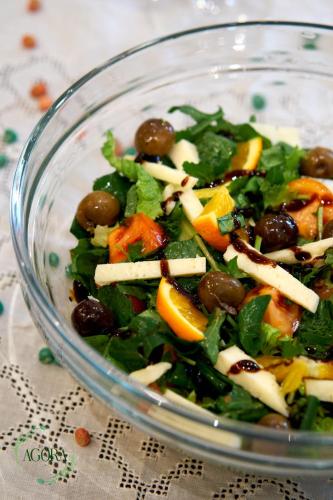 a salad with olives and vegetables in a glass bowl at Agora Bed & Breakfast in Vlorë