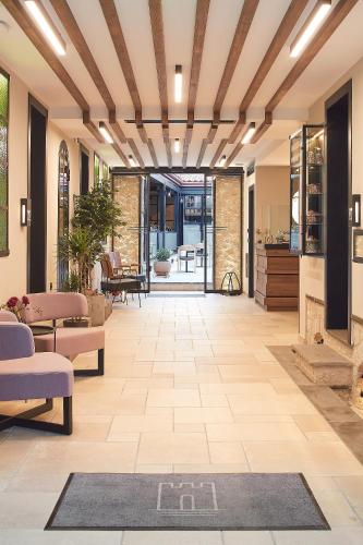 an open lobby with a rug on the floor at IALNA Boutique Hotel in Ioannina