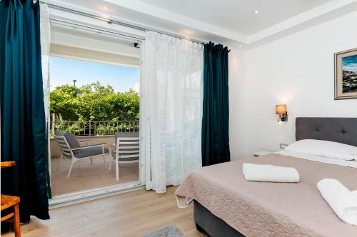 Posteľ alebo postele v izbe v ubytovaní Apartments El Corsaro