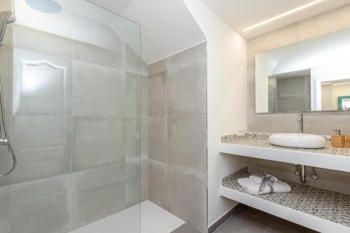a bathroom with a shower and a sink at Apartment Jedy Balear By homevillas360 in Son Serra de Marina