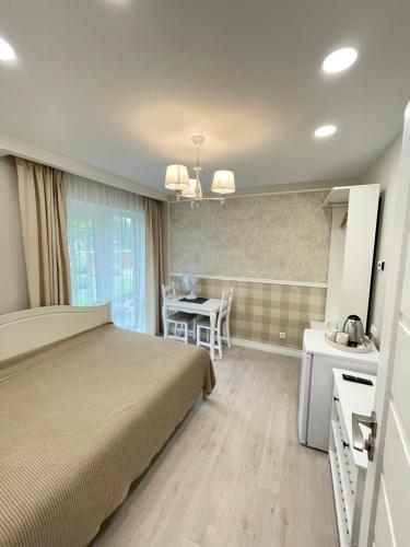 Ένα ή περισσότερα κρεβάτια σε δωμάτιο στο Atostogu sala