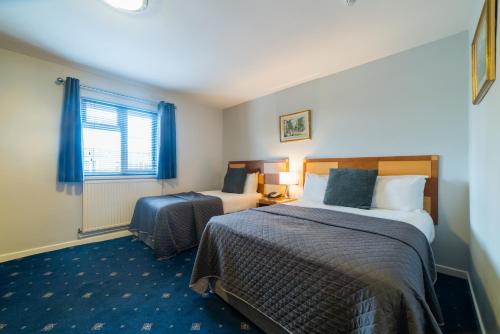 Katil atau katil-katil dalam bilik di Quality Hotel Coventry