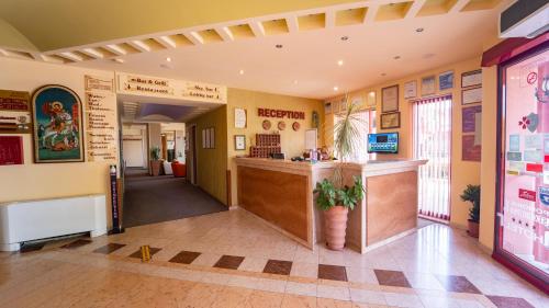 a lobby of a restaurant with a counter at Saint George Hotel & Medical Spa in Pomorie
