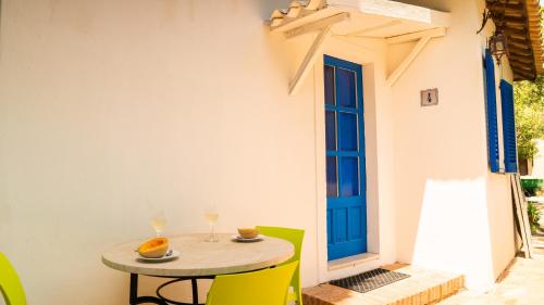 a table and chairs in a patio with a window at Villaggio Placido in Taormina