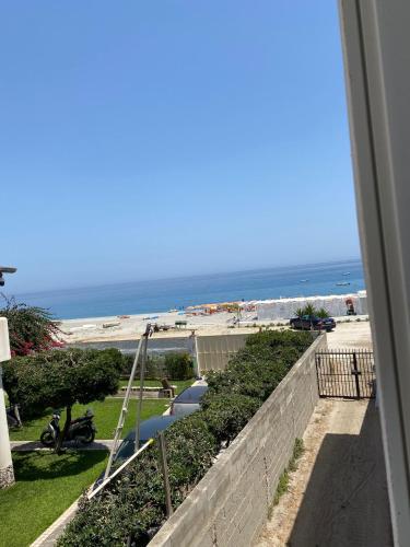 a view of the beach from a balcony at Petit gourmet in Siderno Marina