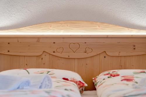 Cama o camas de una habitación en Ospitalità Diffusa Laste Dolomites Cèsa del Bèrba Jaco