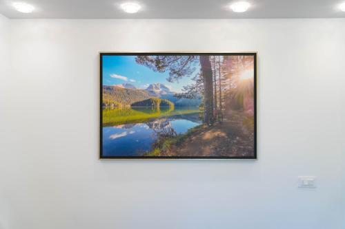 a picture frame hanging on a wall in a room at Villa Lara in Žabljak