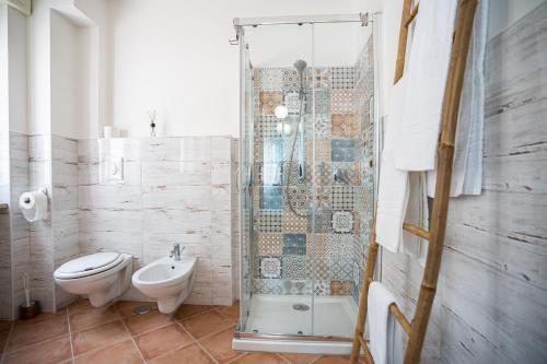 a bathroom with a shower and a toilet and a sink at CasaPo' in Cetraro