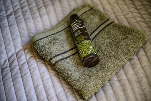 a toothbrush sitting on top of a bed at Place near beach in Pērkone