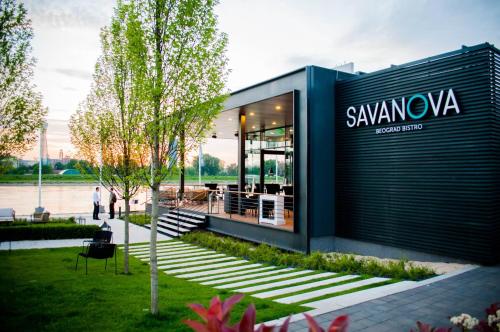 a building with a sanyva sign on the side of it at Beograd na vodi - Belgrade Waterfront Riverside in Belgrade