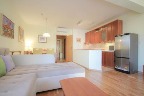a living room with a couch and a kitchen at Roko in Novigrad Istria
