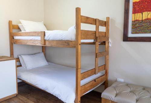 a bunk bed room with two bunk beds at Loerie Guest Lodge in George