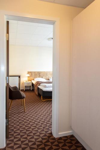Ένα ή περισσότερα κρεβάτια σε δωμάτιο στο Foldens Hotel