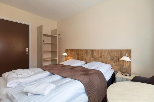 Ένα ή περισσότερα κρεβάτια σε δωμάτιο στο Foldens Hotel
