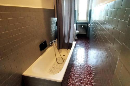 a bathroom with a bath tub with a shower at Locazione Turistica La Primula in Turin