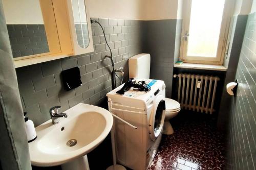 a small bathroom with a sink and a toilet at Locazione Turistica La Primula in Turin