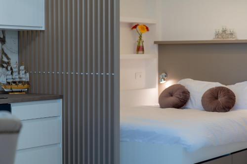 a bedroom with a bed with two pillows on it at VILLA MILENA in Kotor