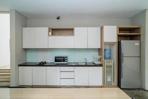 Kuchyň nebo kuchyňský kout v ubytování Three J Residence