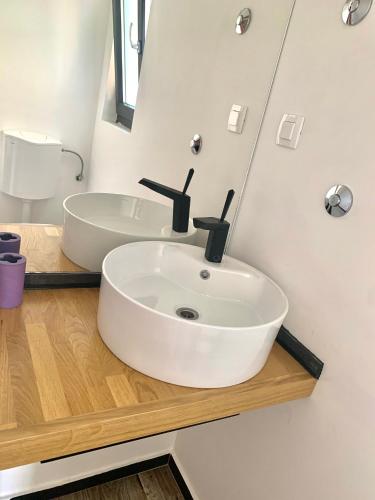 a bathroom with a white sink and a mirror at The perfect stay in Hvar