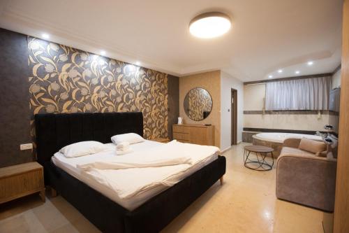 Krevet ili kreveti u jedinici u okviru objekta מלון אחוזת האושר