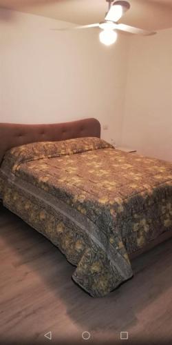 En eller flere senge i et værelse på Casa Marina