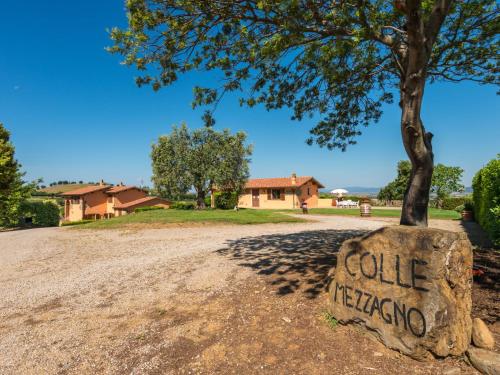 a rock with the words golfing written on it next to a tree at Apartment Leccio by Interhome in Preselle