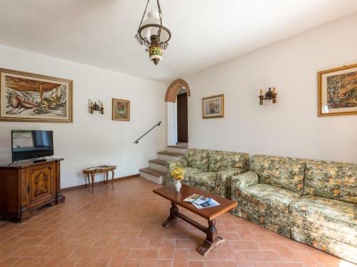 a living room with a couch and a table at Apartment Leccio by Interhome in Preselle