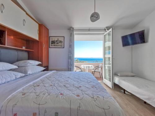 Posteľ alebo postele v izbe v ubytovaní Apartments Vukadin