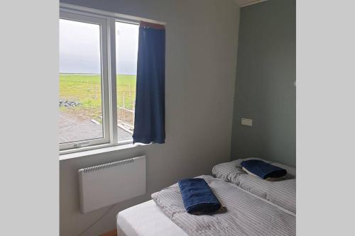Postel nebo postele na pokoji v ubytování Árheimar 6 cosy holiday home
