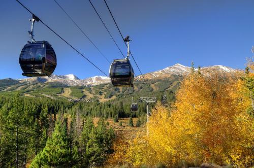 two gondolas on a ski lift in the mountains at Breck Inn in Breckenridge