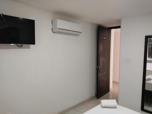 TV a/nebo společenská místnost v ubytování HOTEL ESCALA GC Valledupar