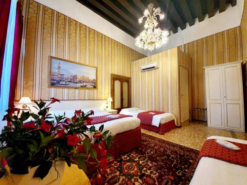 Postel nebo postele na pokoji v ubytování Hotel Corte dei Greci