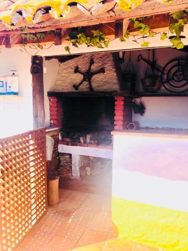 a building with a brick fireplace in a room at Monte Ramos in Ferreira do Alentejo