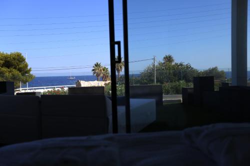a view of the ocean from a window at VILLA MIAMI in Les Issambres