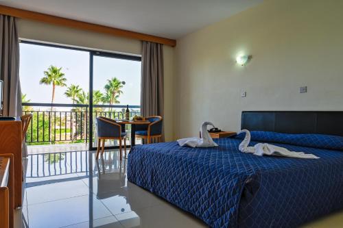 Postel nebo postele na pokoji v ubytování Veronica Hotel
