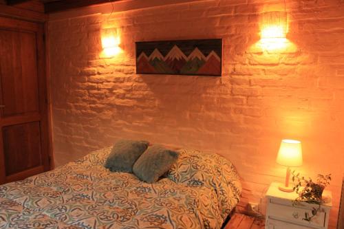 Кровать или кровати в номере Nómada