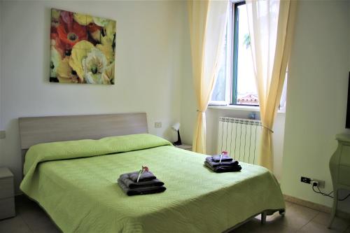 Giường trong phòng chung tại Home & Breakfast La Madonnina 013136-CNI-00001