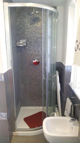 a bathroom with a shower and a sink at La Torretta in Beverino
