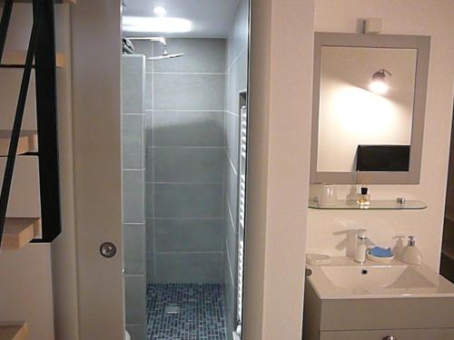 a bathroom with a shower and a sink at Villa le Nid in Nice