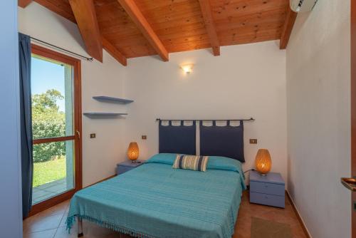 Villa Diomede tesisinde bir odada yatak veya yataklar